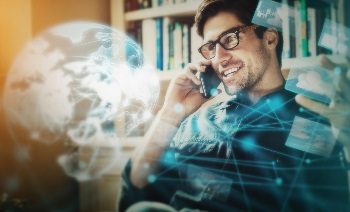 Man on the phone depicting how A.I. connects everything on a global scale